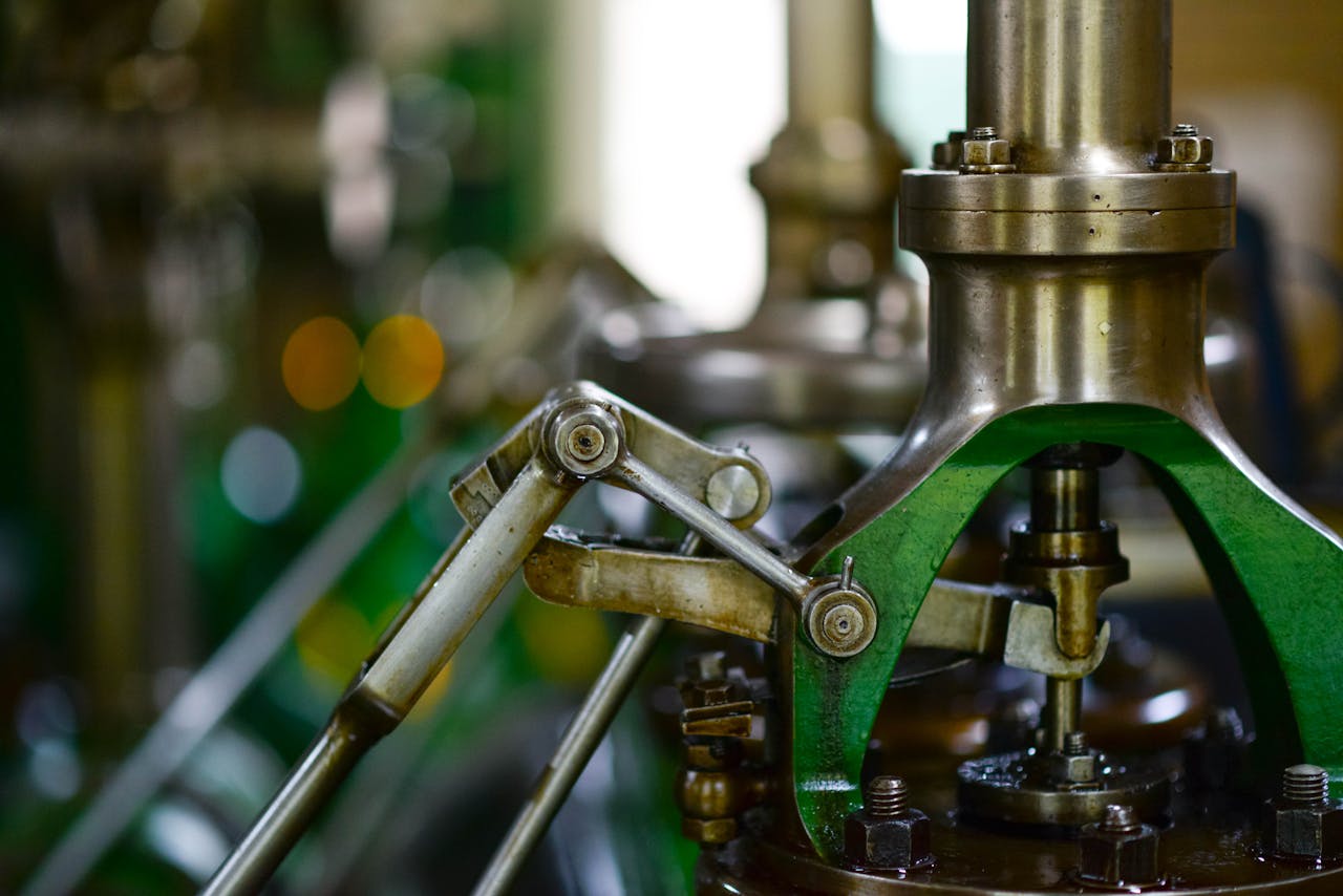 Detailed view of mechanical components in an industrial setting, showcasing metal gears and levers.