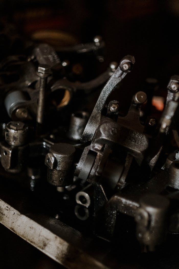 Detailed view of interconnected metal engine components showcasing mechanical intricacy.